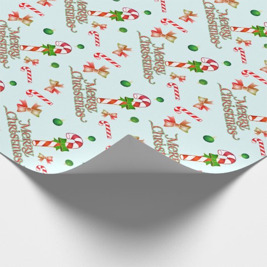 Vrolijk kerstfeest met snoeprietjes en linten cadeaupapier (Hoek)