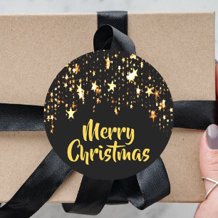Vrolijk kerstfeest op zwart met schijnsterren ronde sticker