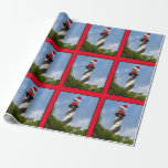 Vrolijk kerstfeest St Augustine Florida vuurtoren Cadeaupapier<br><div class="desc">Dit verbluffende inpakpapier is voorzien van een foto-afbeelding van de historische vuurtoren van Sint Augustinus, die allemaal voor de feestdagen zijn uitgepakt met een feestelijke rode kersthoed, samen met een seizoensgebonden, holle poot die perfect op de toren is gepositioneerd. De iconische vuurtoren met zwarte en witte snoep zijn gelegen in...</div>