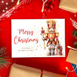 Vrolijk Kerstmis Rode Gouden Notenkraker Feestdagenkaart<br><div class="desc">Verstuur feestelijke vakantiewensen met deze stijlvolle en elegante Merry Christmas Red Gold Notenkraker Holiday Kaart! Deze niet-fotokaart heeft een prachtig waterverf ontwerp en combineert de charme van traditionele kerstthema's met een botanische twist. De iconische notenkraker, gekleed in rood en goud, voegt een vleugje nostalgie toe, terwijl de levendige kleuren en...</div>