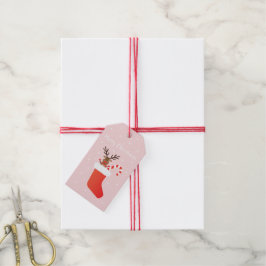 Vrolijk kerstrendier in een stoppelwit cadeaulabel