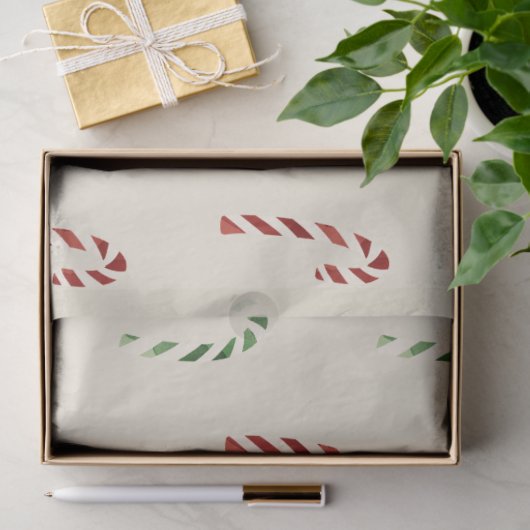 Vrolijk kerstrood en groene snoepjes tissuepapier (Geschenk)