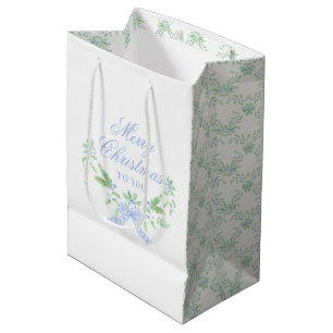 Vrolijk kersttrellis en swag met blauwe boog medium cadeauzakje