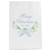 Vrolijk kersttrellis en swag met blauwe boog medium cadeauzakje (Voorkant)