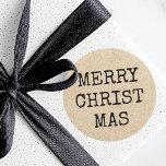 Vrolijke Kerst typemachine typografie Kraft look Ronde Sticker<br><div class="desc">Kerstvakantie stickers met de tekst "Merry Christmas" in een typemachine stijl lettertype op een gedrukte afbeelding Kraft papier look achtergrond.</div>