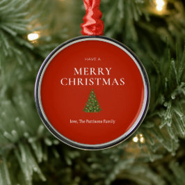 Vrolijke kerstgroet met boom op rood gebruik metalen ornament
