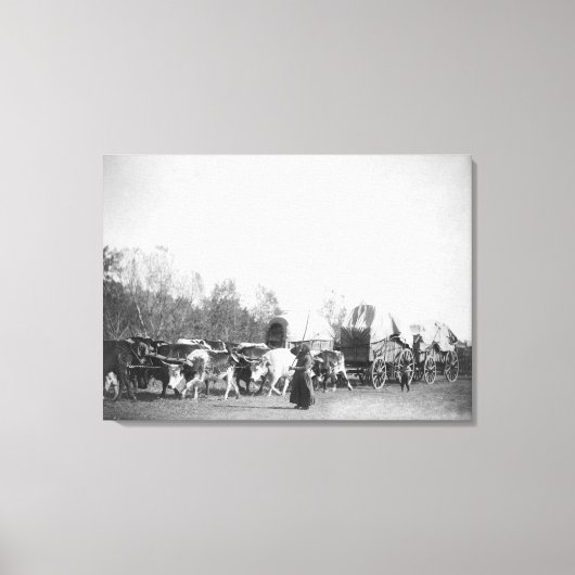 Vrouw en jongen met bultrugaars in Ox Train Canvas Afdruk (Voorkant)