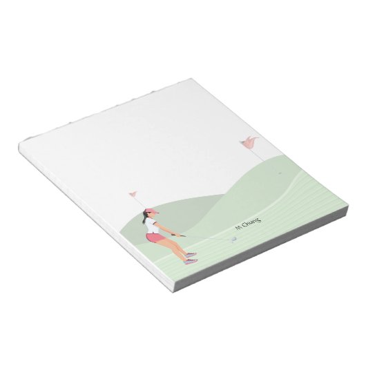 Vrouw golfer golft op koers notitieblok (Schuin)