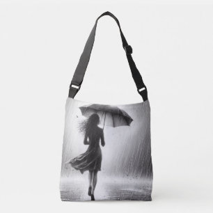 Vrouw loopt rustig in de regen met paraplu crossbody tas