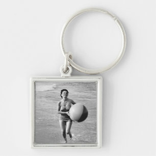 Vrouw met een strand sleutelhanger