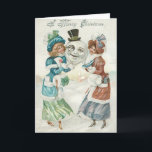 Vrouw Snowman Sigaret Monocle Top Hat Feestdagen Kaart<br><div class="desc">Deze sneeuwman ziet eruit alsof hij een avondje plezier heeft. Deze vintage kerstprint toont twee vrouwen die het hoofd van een sneeuwman vasthouden. De sneeuwman heeft een monocle,  een hoge hoed en een sigaret in zijn mond. Het is een winterse scène overal,  een kerk op de achtergrond.</div>