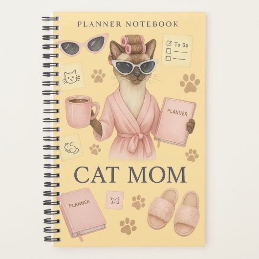 Vrouwelijke kat houdt dagelijkse planner vast (Voorkant)