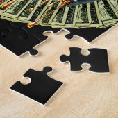 Vrouwen hand 100 dollar biljetten druppelen vloeib legpuzzel (Zijkant)