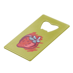 Vruchtpatroonaardbeien op gouden feestartikelen creditkaart flessenopener