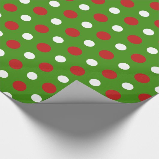 Vun kerstpokadots in de rode en witte omhulling cadeaupapier (Hoek)