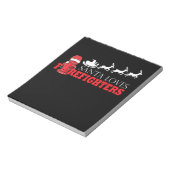 Vuurbrandweerman met kerstcadeaus voor kerstcadeau notitieblok (Linkerzijde)