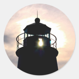 vuurtoren op zonsondergang ronde sticker