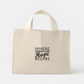 "Waar duisternis eindigt, begint de hoop." Mini Tote Bag (Achterkant)