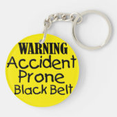 Waarschuwingsongevallenprothese zwarte gordel sleutelhanger (Achterkant)