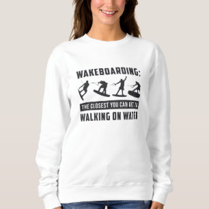 Wakeboarder wakeboarden die op watergolf lopen trui