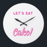 Wall Clock Grote Klok<br><div class="desc">Add a sprinkle of sweetness to your space with this fun and playful wall clock! Featuring bold, pink typography and the delicious phrase “LET’S EAT Cake!”, this design is perfect for kitchens, dining rooms, cafés, or anywhere you want to serve up some joy. Whether you're a dessert lover, a baking...</div>
