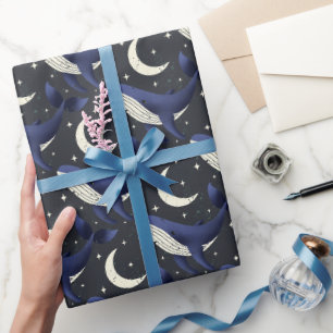 Walvis in de sterren met de maan op donkerblauw cadeaupapier