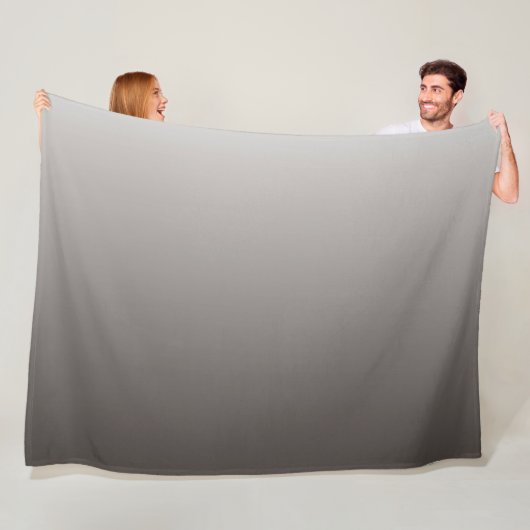 Warm grijs licht tot diepe tonen fleece deken (In situ)