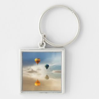 Warme luchtballonnen waterreflectie sleutelhanger