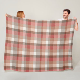 Warme rustieke geruite stoftextuur in koraal fleece deken