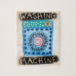 Wasmachine puzzel legpuzzel<br><div class="desc">Een schattige en gekke wasmachine voor saaie wasdagen. In blauw,  turquoise en beige met rode en zwarte accenten.</div>