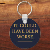 WAT IS DE MENS – Bro Scott acryl sleutelhanger (Achterkant)