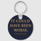 WAT IS DE MENS – Bro Scott acryl sleutelhanger (Achterkant)