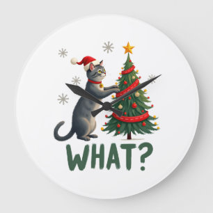 Wat is een grappige kat die een kerstboom omver du grote klok