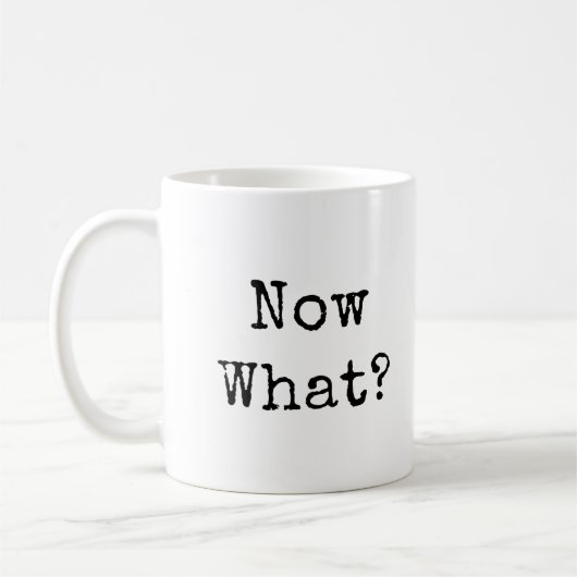 Wat nu? in eenvoudig modern lettertype koffiemok (Links)