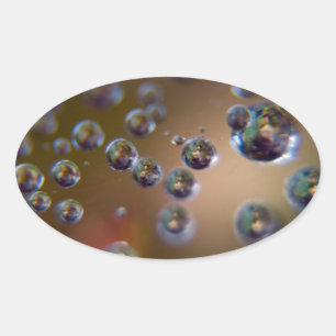 Waterdruppels in beweging ovale sticker