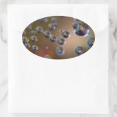 Waterdruppels in beweging ovale sticker (Tas)