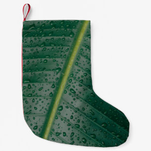 Waterdruppels op bananenblad kleine kerstsok