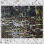 Waterlieten in Pond door Claude Monet,  kunst Legpuzzel<br><div class="desc">Waterlivons van Claude Monet is een kunstschilderij met een kunstschilderij met waterlappen in een vijver in de tuin van Monet in zijn huis in Giverny, Frankrijk. Wilde bomen hangen over het water en de Japanse voetbrug is op afstand. Een reeks van meer dan 250 waterlievige bloemschilderijen die Monet de laatste...</div>