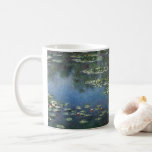 Waterlioenen van Claude Monet,  bloemen Koffiemok<br><div class="desc">Water Lilies (1906) van Claude Monet is een impressionisme in het kunstlandschap schilderij. Het is een van de vele variaties van waterlelie schilderijen die Monet schilderde in zijn bloemtuin in Giverny, Frankrijk. Waterlelijke bloemen in een veerseizoen vijver. Over de kunstenaar: Claude Monet (1840-1926) was een oprichter van de Franse impressionistische...</div>