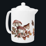 Waterverf Botanische kunstpaddenstoelen en valluik Theepot<br><div class="desc">Deze natuur met de thema theepot heeft waterverf,  botanische kunstillustraties van bijtende paddenstoelen,  herfstbladeren,  rozen heupen en kleurrijke motten voor een driedubbele katoenen blik. Geweldig keukencadeau. Overeenkomende objecten in onze winkel.</div>