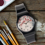 Waterverf Cherry Blossom Bloemen Girly Monogrammed Horloge<br><div class="desc">Voeg een vleugje elegantie toe met deze Waterverf Cherry Blossom Floral Girly Monogrammed Watch! Met een delicate kersenbloesem waterverf in roze en blauwe tinten, combineert dit horloge schoonheid en functionaliteit. Zwarte typografienummers lijsten het ontwerp, terwijl uw gepersonaliseerde initialen of monogram in elegant zwart script een unieke toets onder de wijzers...</div>