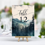 Waterverf dennenboom berg bruiloft kaart<br><div class="desc">Breng de rustieke charme van het buitenleven naar uw receptie met de Waterverf Pine Tree Mountain Wedding Table Number. Met een prachtige waterverf van dennenbomen geplaatst tegen een bergachtige achtergrond, wordt elk tafelnummer elegant weergegeven in duidelijke, moderne typografie op hoogwaardige kaartvoorraad. Deze tafelnummers helpen gasten niet alleen bij het vinden...</div>