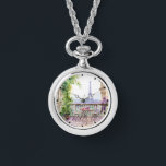 Waterverf Eiffeltoren Parijs Frans Café Horloge<br><div class="desc">Waterverf Eiffeltoren Paris French Cafe Watch Ketting beschikt over een waterverf Franse café zithoek met Paris en de Eiffeltoren op de achtergrond. Creëer door Evco Studio www.zazzle.com/store/evcostudio</div>