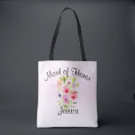 Waterverf Flowers Bouquet Maid of Honor Wedding Tote Bag<br><div class="desc">Dit tas is de perfecte waszak voor het bedanken van je dienstmeisje voor haar harde werk waardoor je trouwdag speciaal werd. Het bevat een prachtige waterverf boeket van wilde bloemen, pansieën of violetten op een bleke roze achtergrond. De ondertitel boven staat: Maid of Honor, en er is ruimte voor haar...</div>