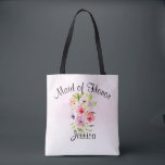Waterverf Flowers Bouquet Maid of Honor Wedding Tote Bag<br><div class="desc">Dit tas is de perfecte waszak voor het bedanken van je dienstmeisje voor haar harde werk waardoor je trouwdag speciaal werd. Het bevat een prachtige waterverf boeket van wilde bloemen, pansieën of violetten op een bleke roze achtergrond. De ondertitel boven staat: Maid of Honor, en er is ruimte voor haar...</div>