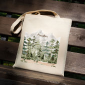 Waterverf groen dennenbos op berg tote bag