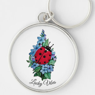 Waterverf luivogel met blauwe wilde bloemen sleutelhanger