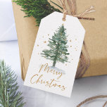 Waterverf Pine Christmas Tree Gold Cadeaulabel<br><div class="desc">Dit label met kerstcadeaus is voorzien van een waterverf dennenkerstboom met kleine gouden sterren en een gouden script voor vrolijk kerstfeest.</div>