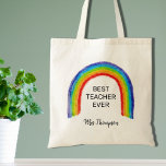 Waterverf regenboogleraar Dank je cadeau Tote Bag<br><div class="desc">De Canvas tas van deze leraar is versierd met een kinderachtige regenboog en de woorden Beste leraar ooit. Eenvoudig aan te passen met de naam van uw favoriete leraar.</div>