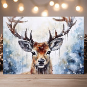 Waterverf rendieren in de sneeuw feestdagen kaart